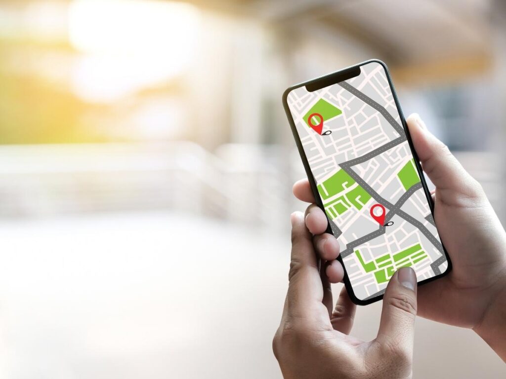 Tourist using offline maps app for navigation in foreign city
