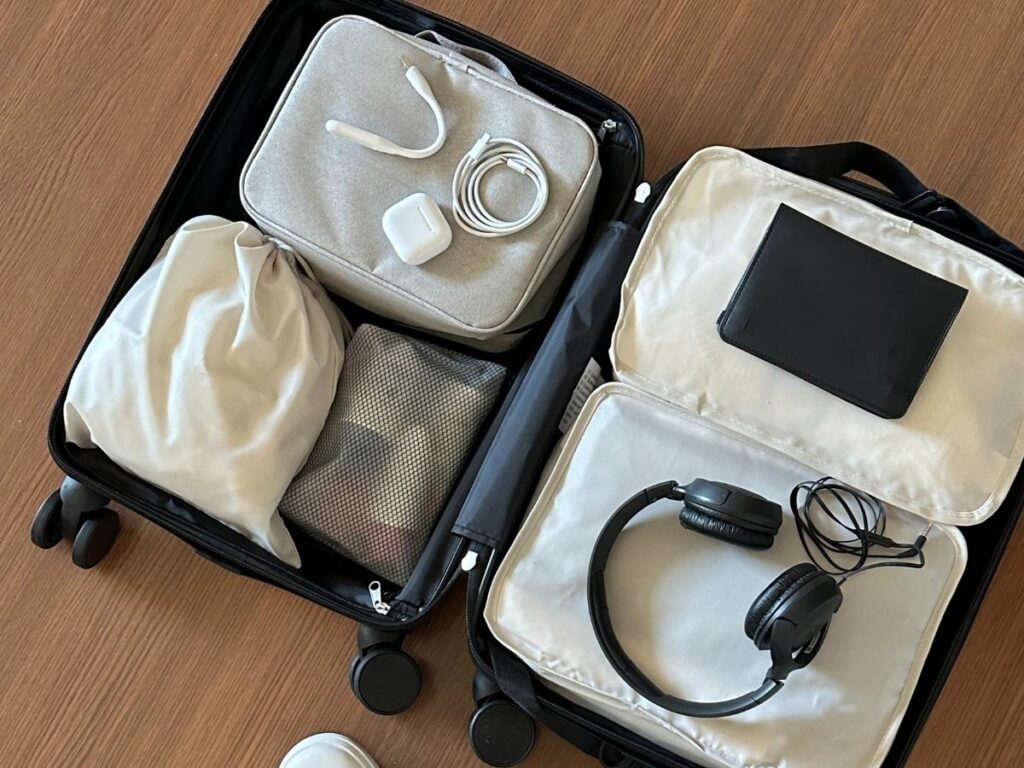 Packing cubes organizing clothes inside a carry-on suitcase