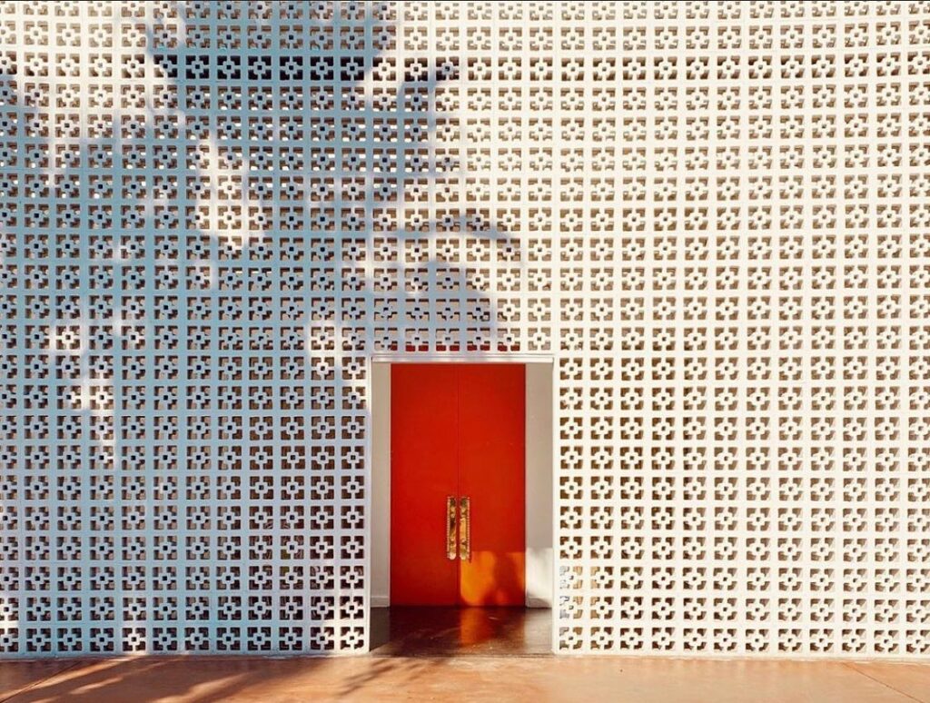Iconic orange entrance doors at Parker Palm Springs hotel