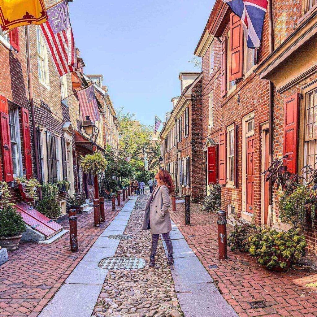 Historic cobblestone Philadelphia Alley with brick buildings in Charleston