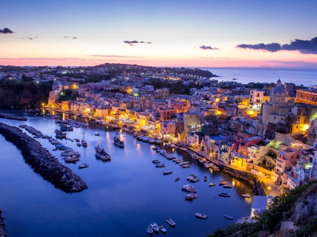 Pastel-colored buildings of Marina Corricella harbor in Procida island