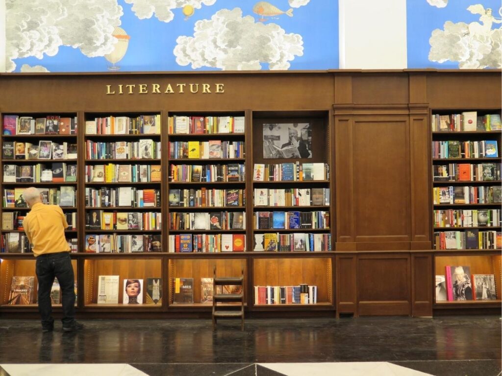 Elegant Rizzoli Bookstore interior with chandeliers and art coffee table books near Flatiron