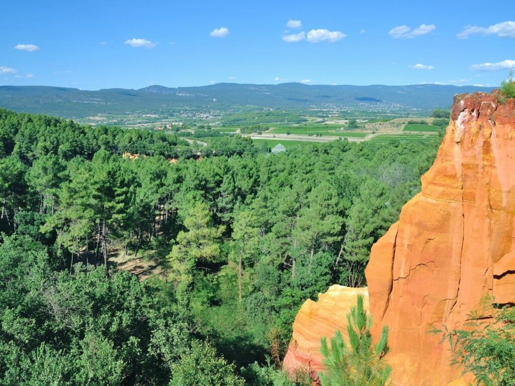 Roussillon village with orange and red ochre buildings in Luberon Provence