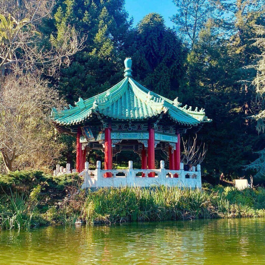 Golden Gate Pavilion reflected in the calm waters of Stow Lake