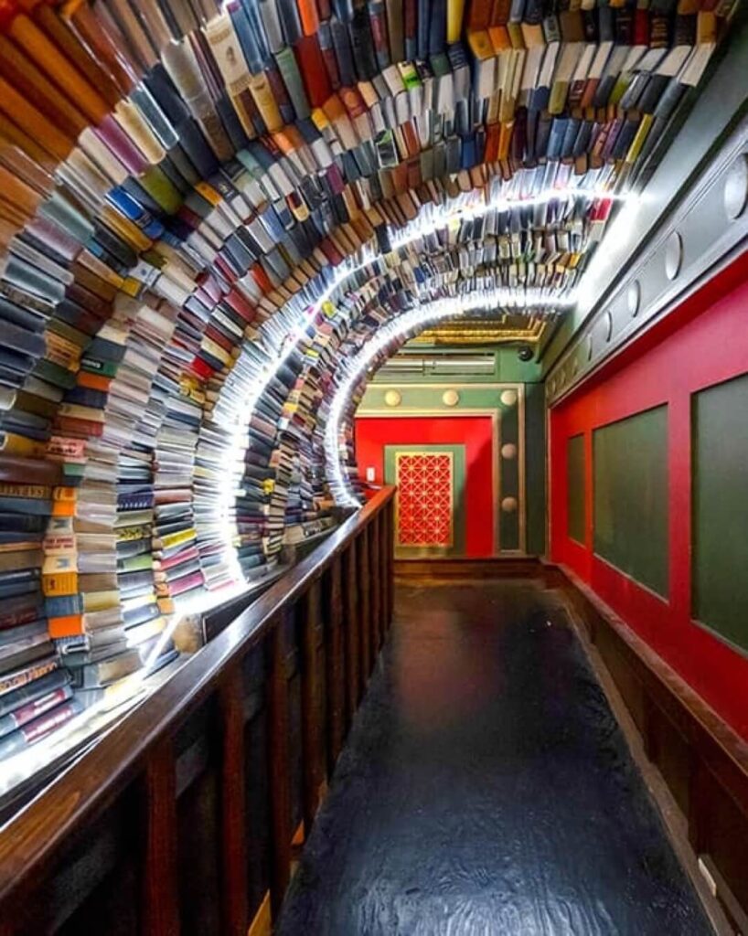 Tunnel made of stacked books inside The Last Bookstore in Downtown Los Angeles