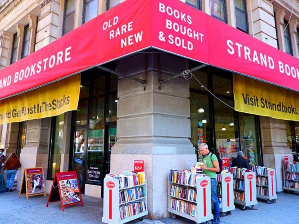 The Strand iconic red storefront near Union Square with 18 miles of books sign