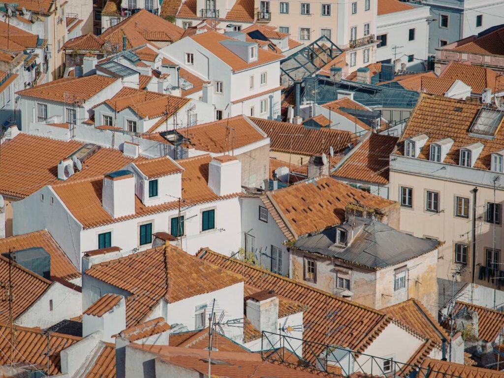 Aerial view of Toulouse terracotta rooftops along Garonne River showing the Pink City architecture in France