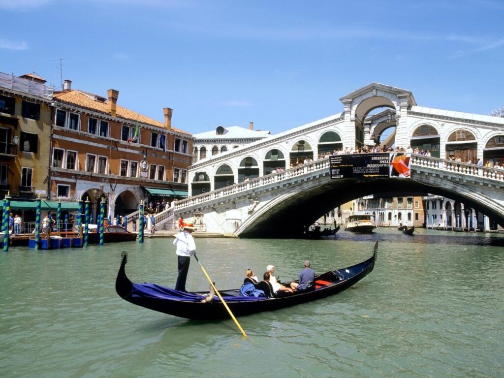 Gondolas on the Grand Canal in Venice Italy with historic architecture