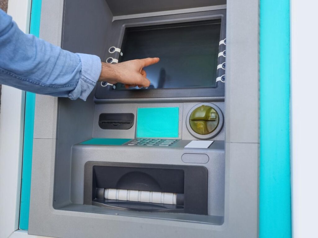 ATM screen asking traveler to pay in dollars or local currency Europe