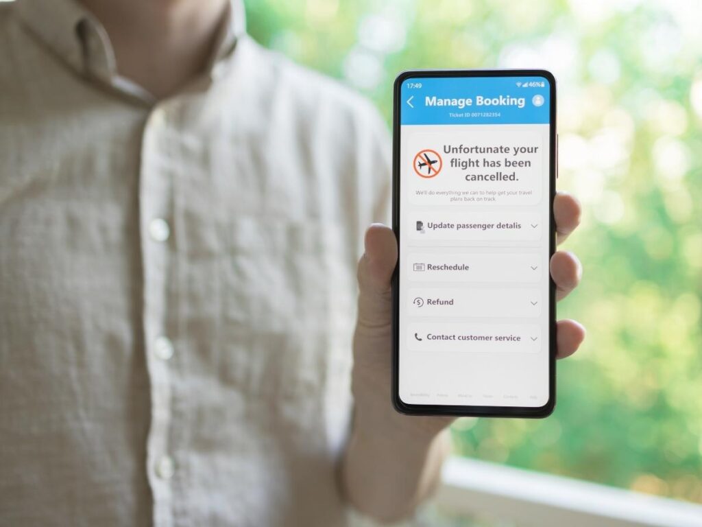 Smartphone screen showing a travel award availability alert notification for a business class flight deal