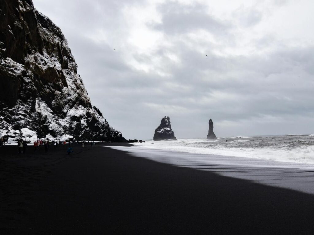Dramatic black sand beach with shale cliffs along California's Lost Coast in Shelter Cove