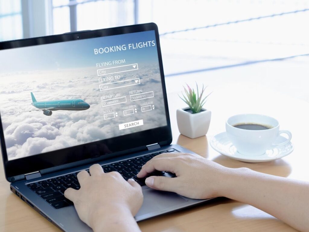 Flight booking confirmation screen showing a business class seat booked with points and minimal taxes paid