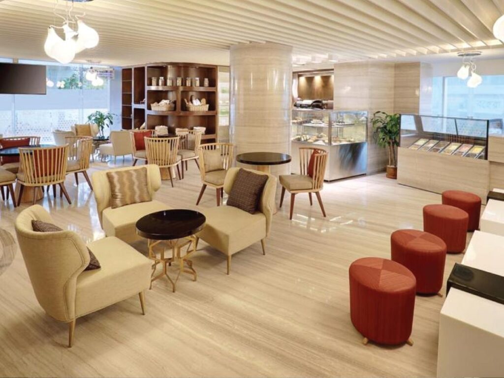 Charming boutique hotel lobby with breakfast area showing personalized service and character