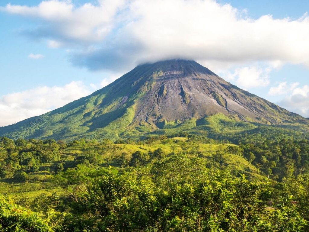  Arenal Volcano surrounded by lush rainforest in Costa Rica
