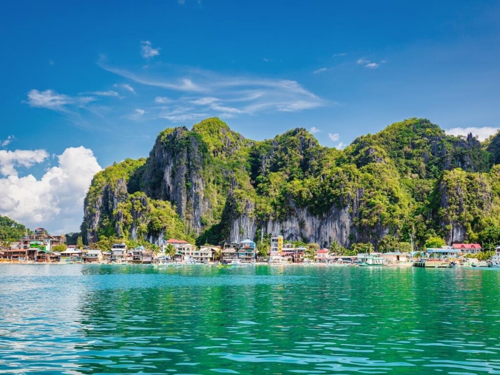  Turquoise lagoon surrounded by limestone cliffs in Palawan Philippines