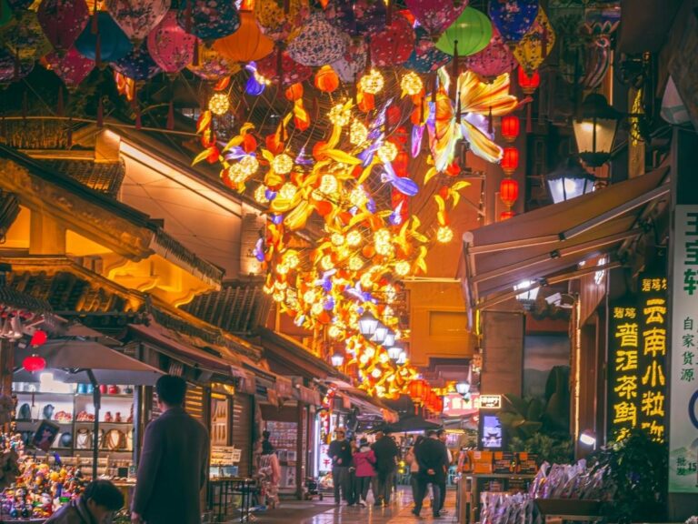 Colorful street food market in Southeast Asia with lanterns and local vendors
