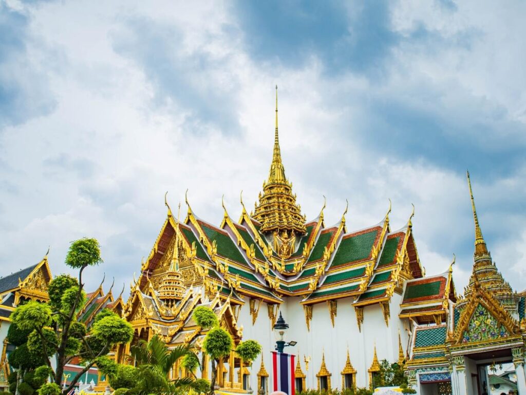  Grand Palace Bangkok Thailand with golden spires and ornate temples

