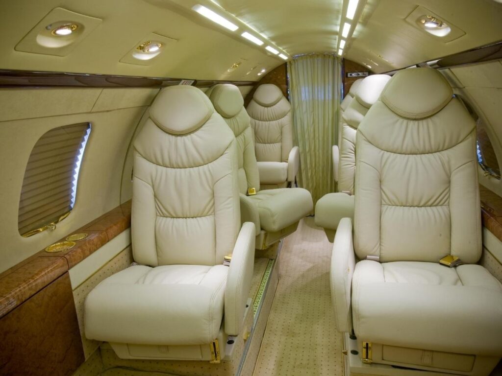Spacious business class cabin with wide leather seats and mood lighting on a long-haul flight