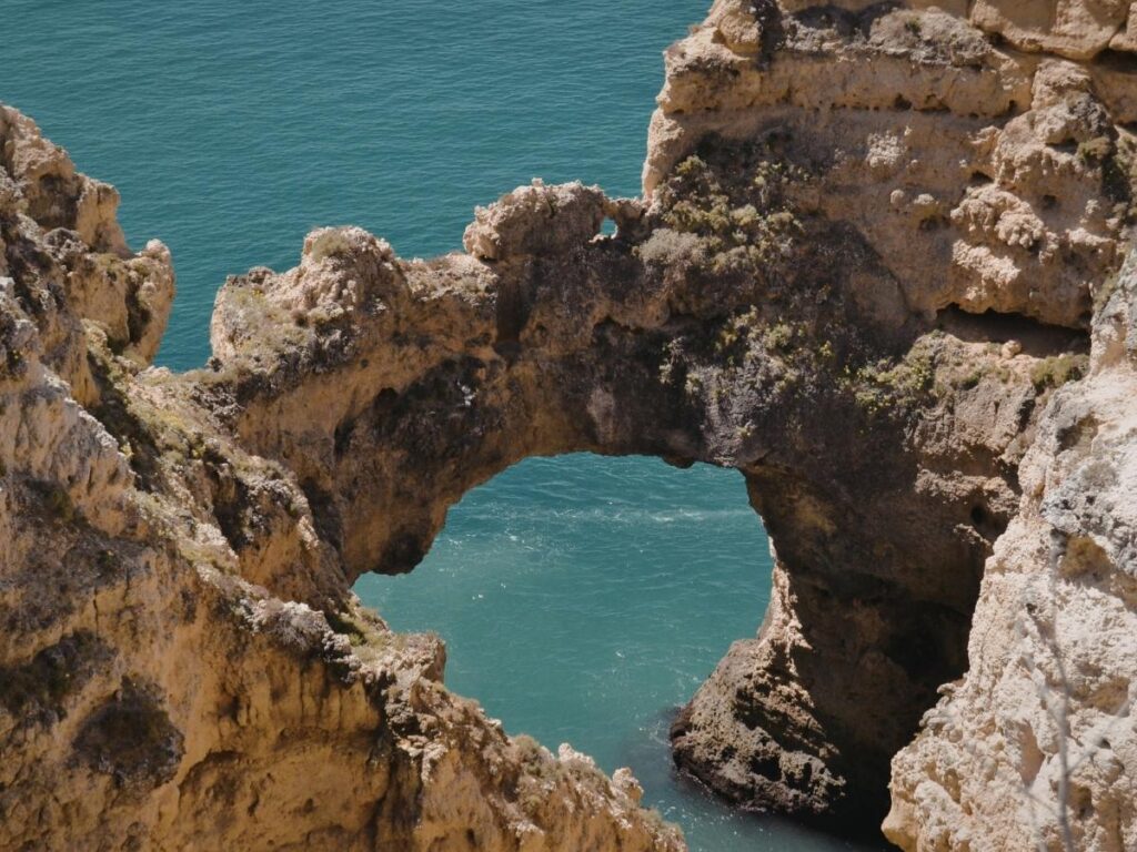 Natural arch rock formation at Hole in the Wall Beach in Olympic National Park, Washington