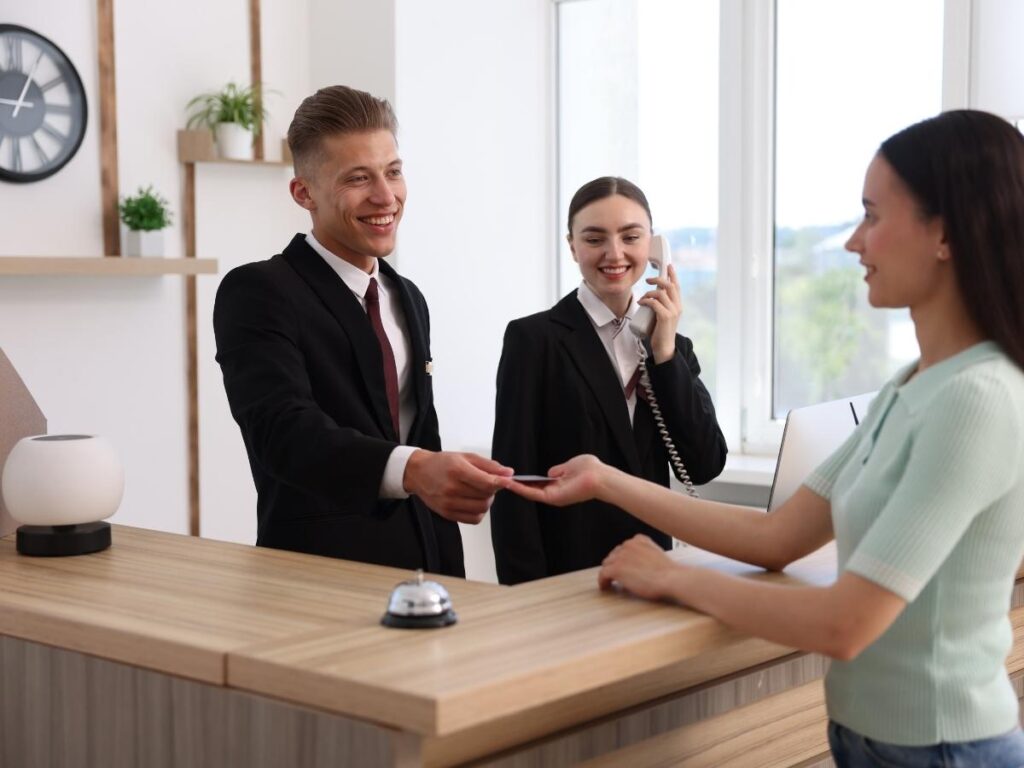  Friendly hotel reception desk with staff available for guest assistance and support