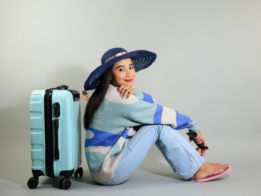 Woman wearing tank top with cardigan layered outfit for flight