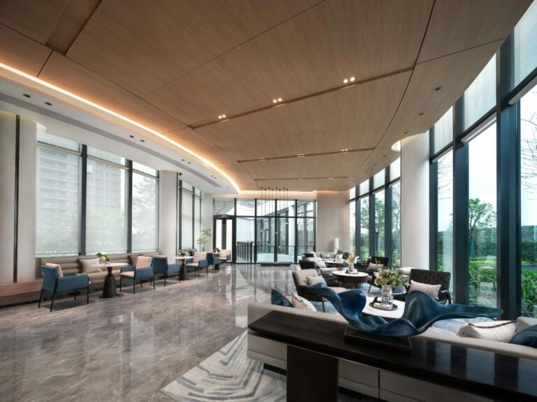 Elegant luxury hotel lobby with modern design, marble floors, and sophisticated lighting