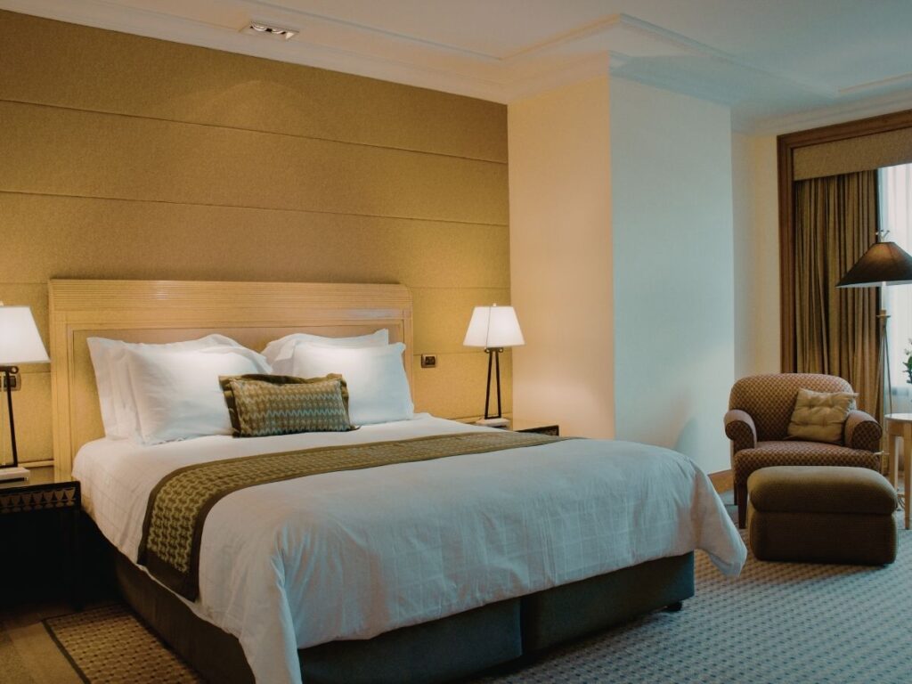 Luxury hotel bathroom featuring marble soaking tub and premium amenities