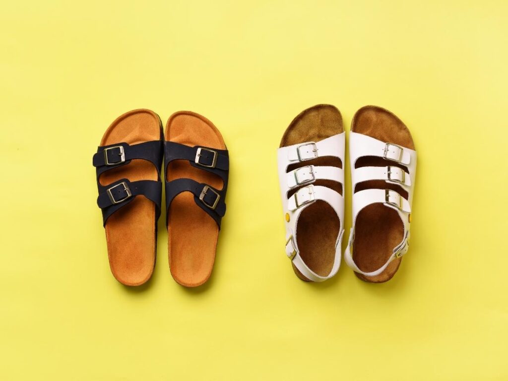 Three pairs of versatile travel shoes including walking sneakers and sandals