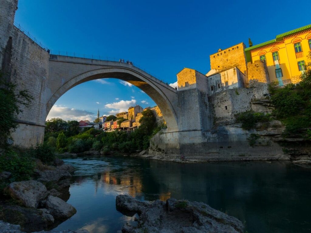 The iconic Stari Most Ottoman bridge in Mostar Bosnia and Herzegovina arching over the Neretva River with the old town in the background