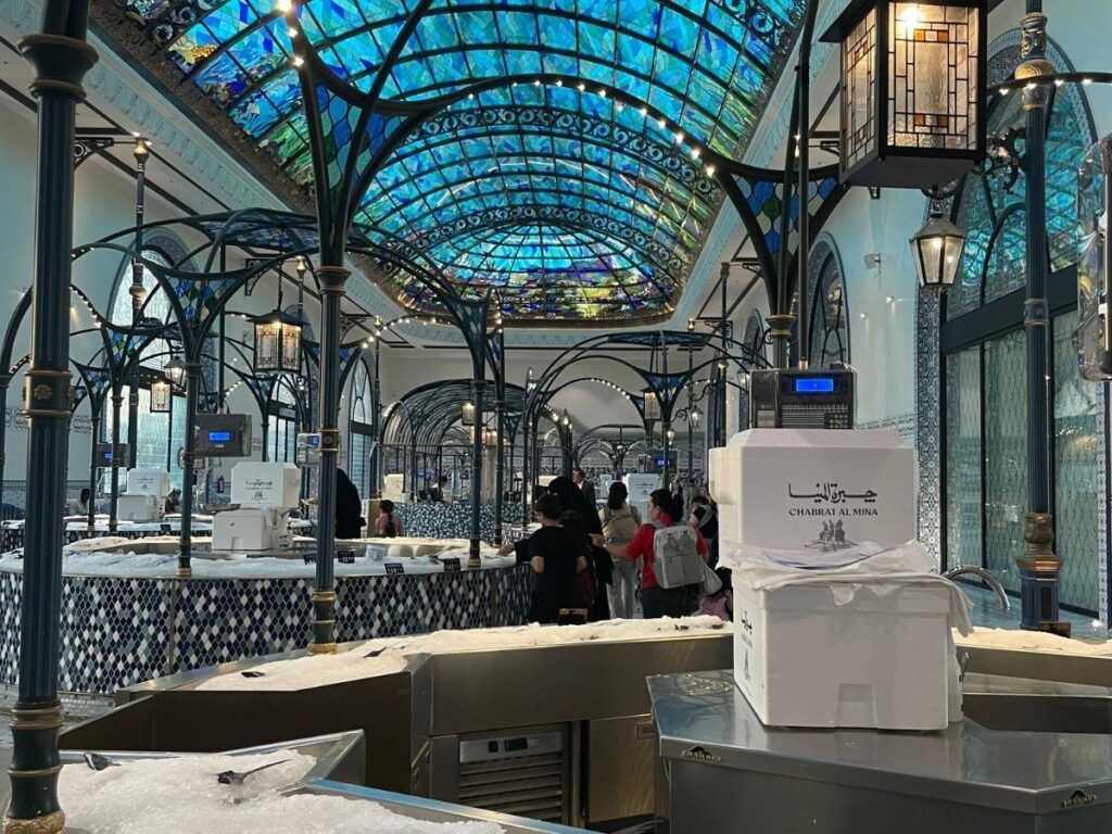 Qatar Airways Al Mourjan Business Lounge at Hamad International Airport in Doha with reflection pool