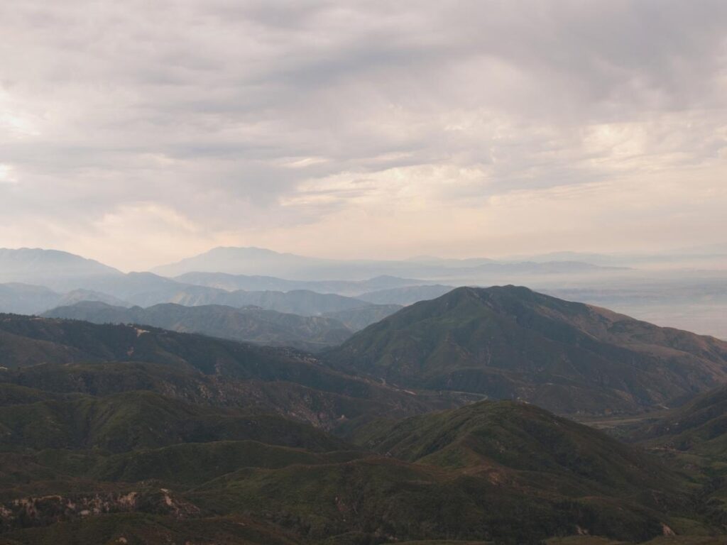 Panoramic view from the Rim of the World Scenic Byway in the San Bernardino Mountains California looking out over a vast green valley below