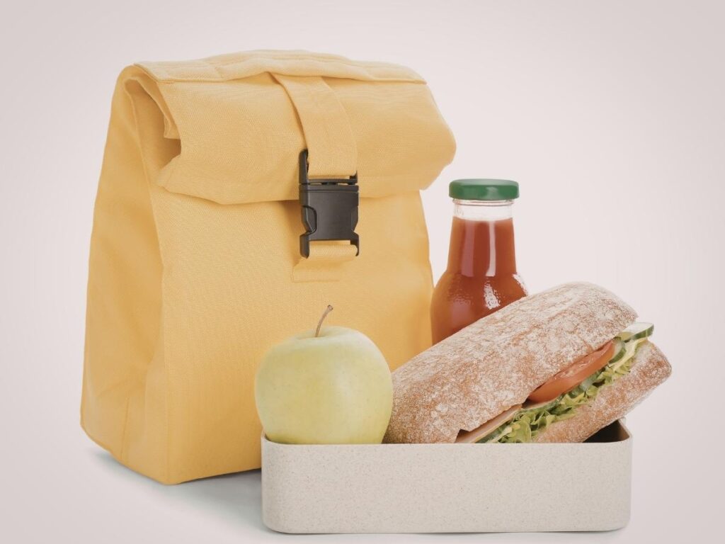 Cooler packed with sandwiches and drinks for budget-friendly road trip meals