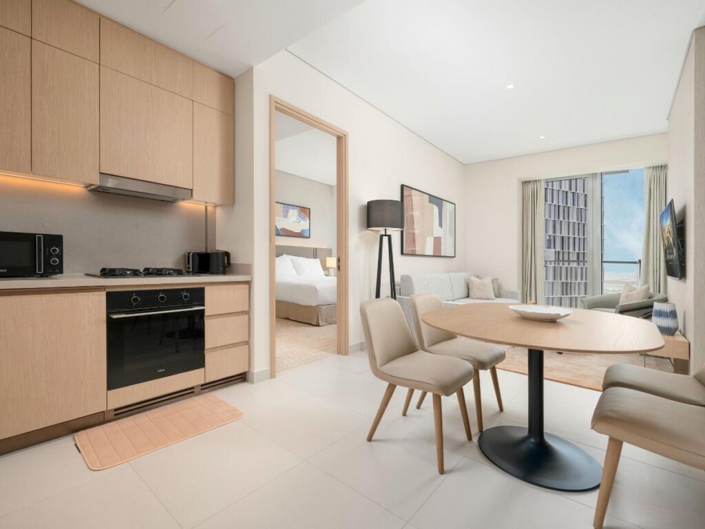 Modern serviced apartment with full kitchen and hotel amenities for long-term stays
