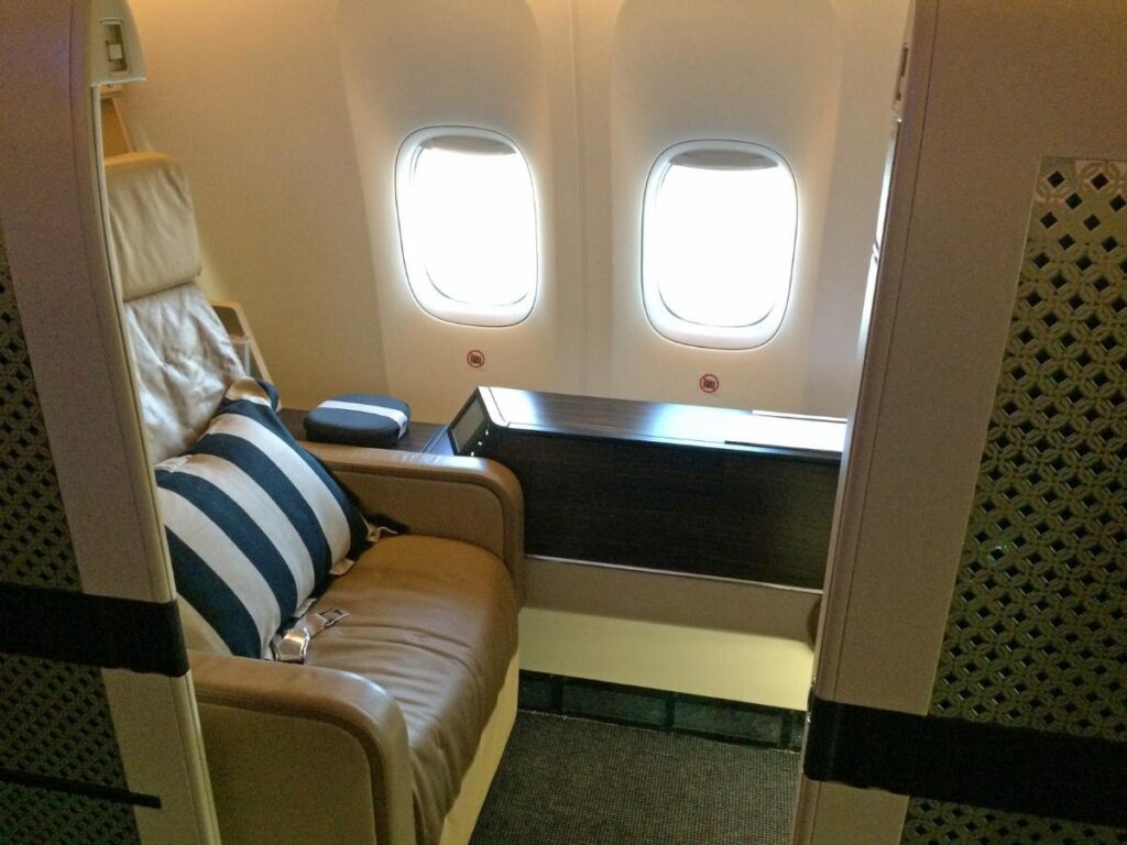 Singapore Airlines first class suite on Airbus A380 with separate bed and private cabin layout