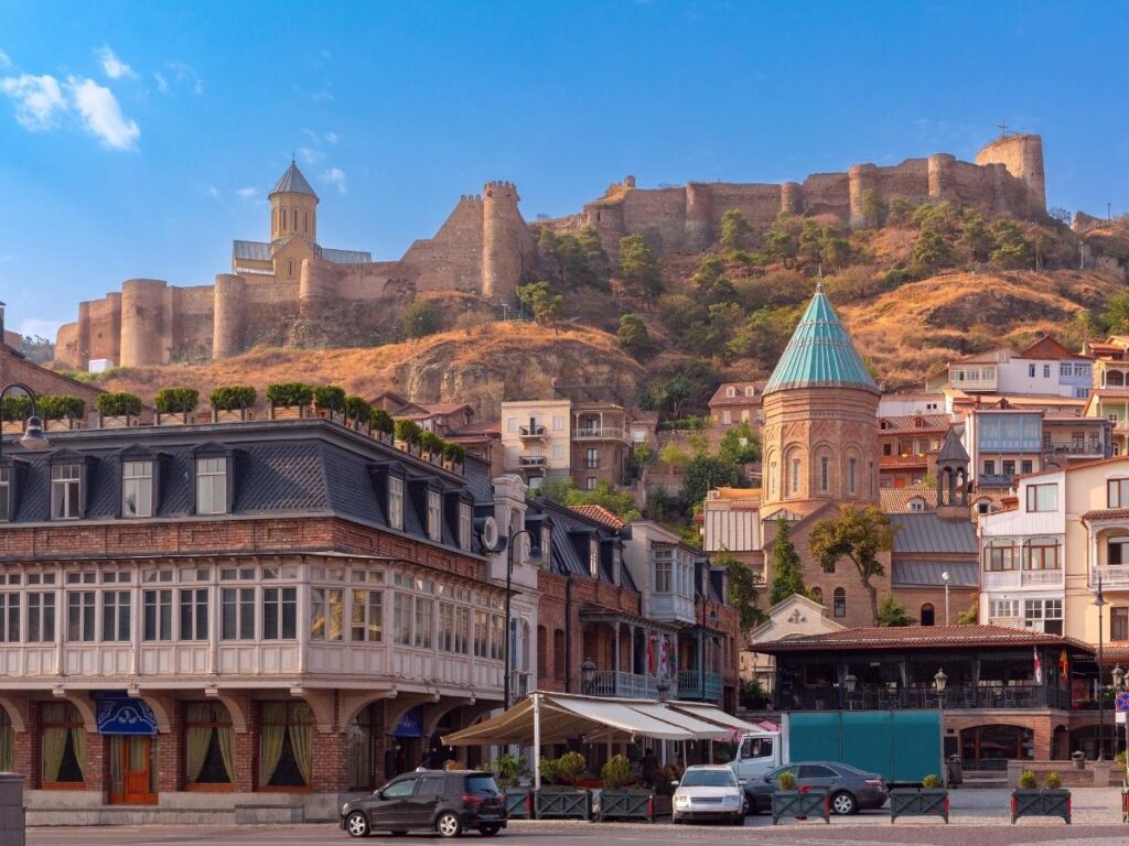 Tbilisi Georgia old town with carved wooden balconies sulfur bath district and Narikala Fortress on the hillside