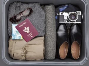 Organized suitcase with packing cubes and neatly rolled clothes for travel