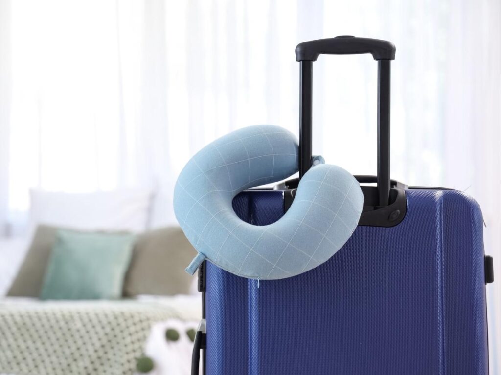 Trtl travel pillow worn by passenger on airplane seat