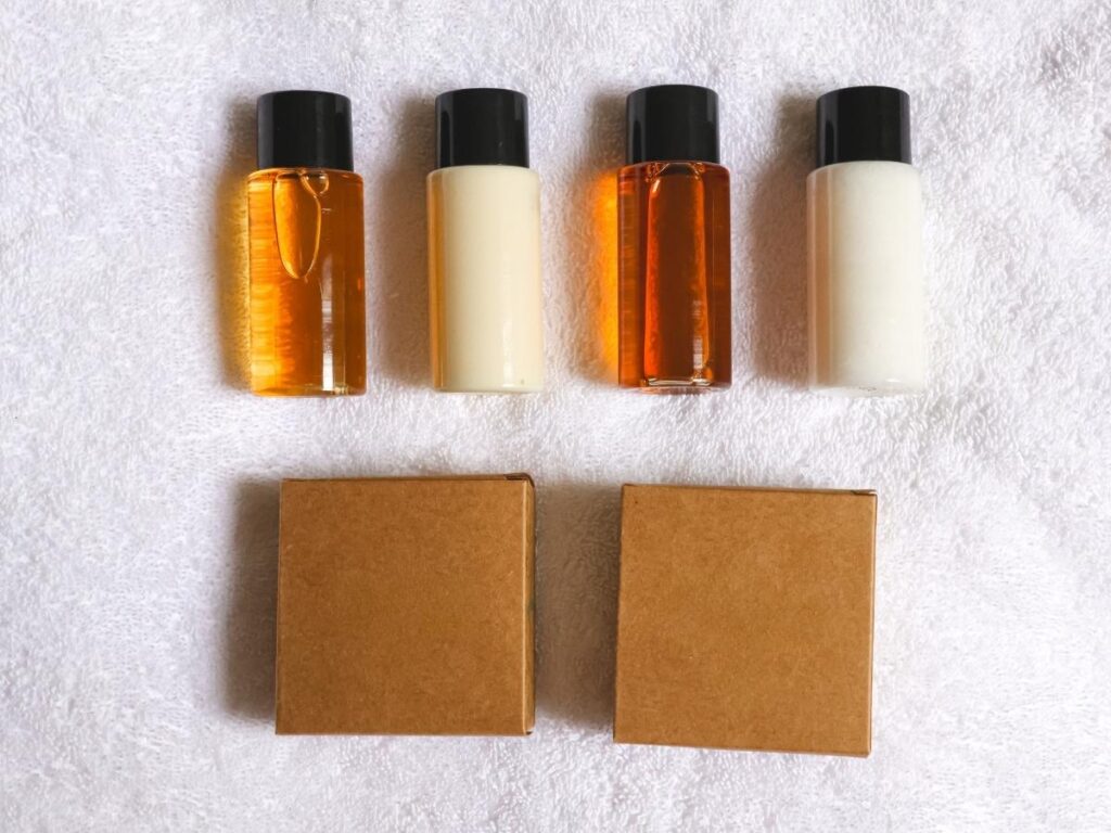 Travel-size toiletries and solid shampoo bars in clear TSA-approved containers