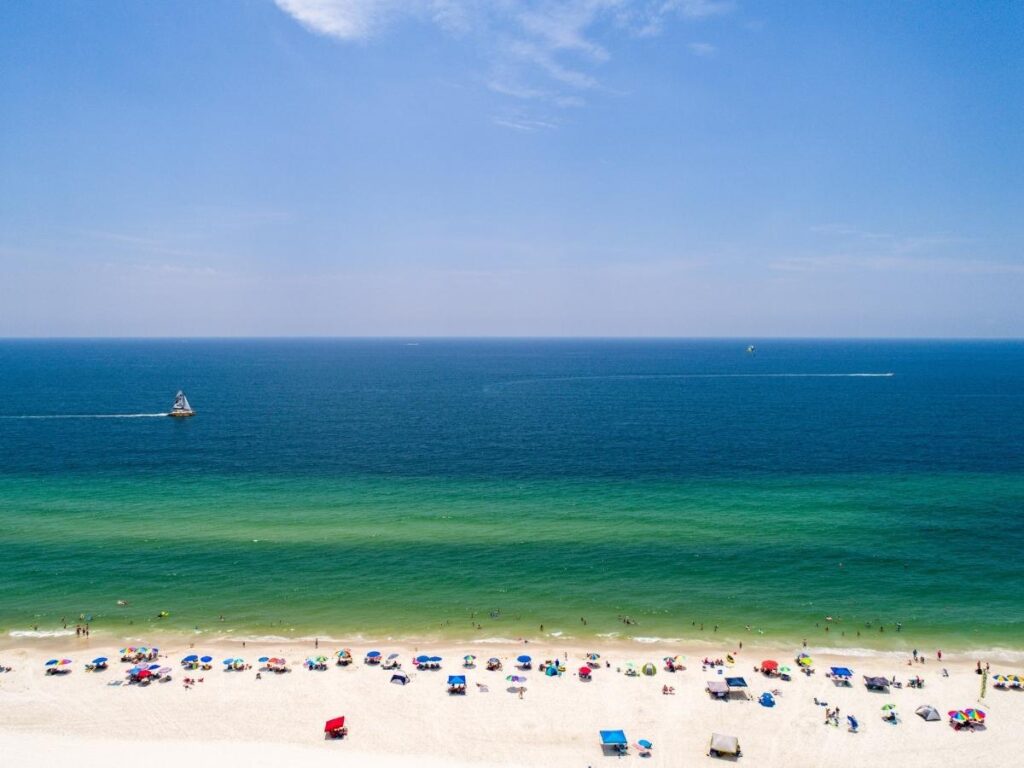 Powdery white sand and turquoise Gulf of Mexico waters at West Beach, Gulf Shores, Alabama