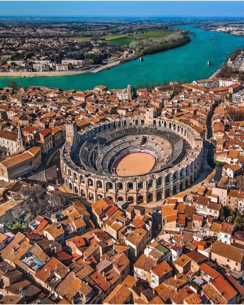 Quiet street in Arles with historic buildings and warm light