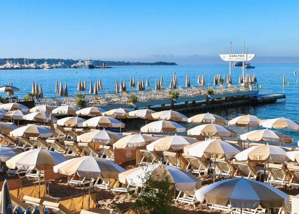 Sunbeds and umbrellas at a beach club in Cannes