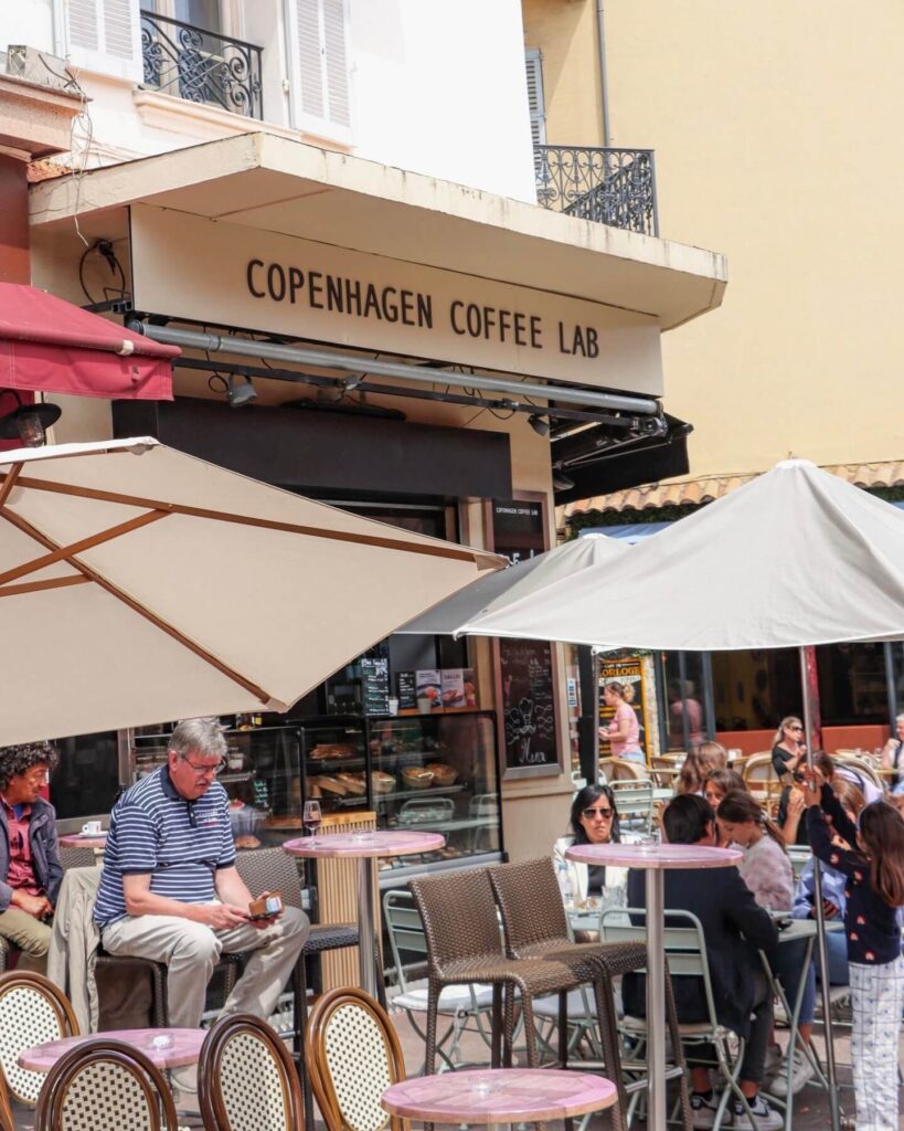 Outdoor café dining scene in Cannes with a relaxed atmosphere