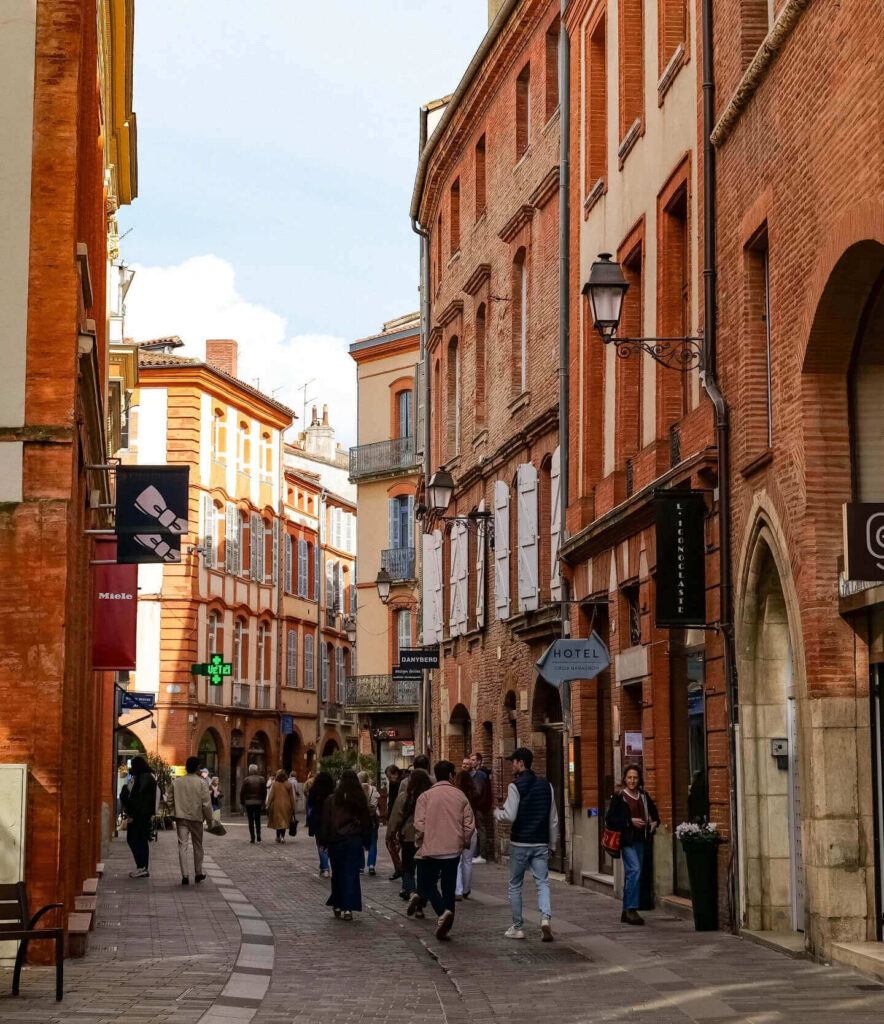 Place du Capitole in Toulouse with people, cafés, and lively atmosphere