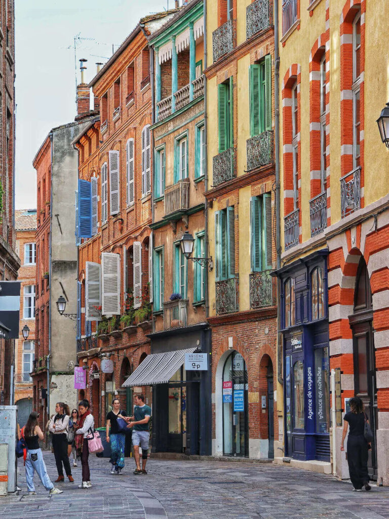 Charming narrow streets in Carmes district Toulouse with cafés and shops