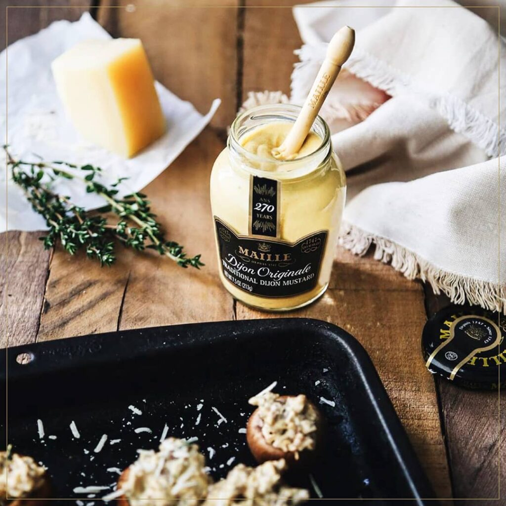 Tasting different varieties of Dijon mustard in a local shop