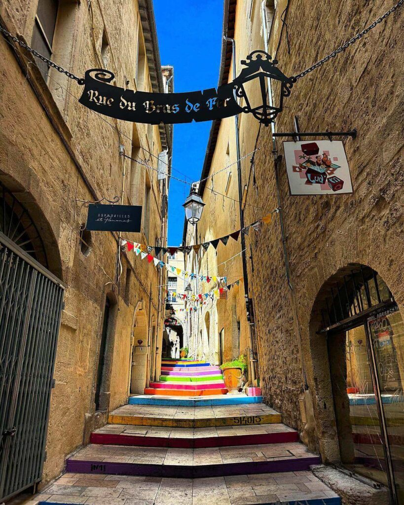 Narrow streets in Écusson old town Montpellier with historic buildings