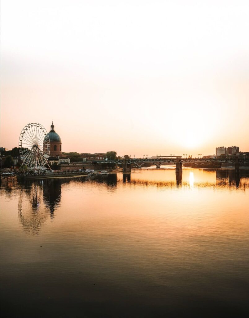 Garonne River in Toulouse during sunset with people relaxing by the water