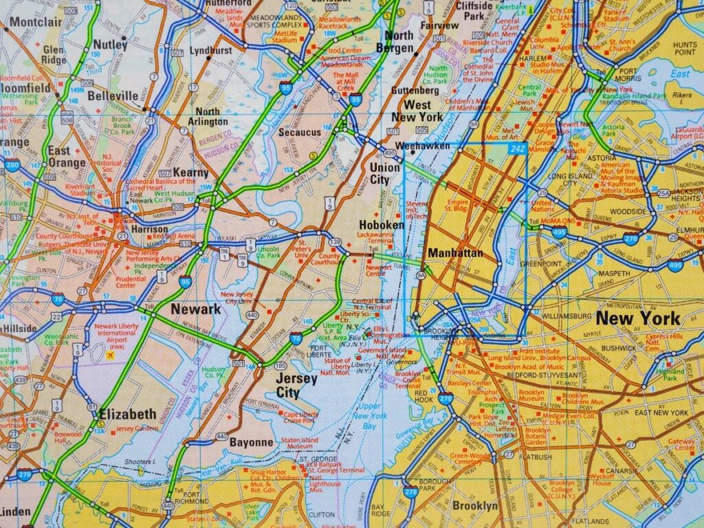 Google Maps zoomed into a city showing pale yellow highlighted areas of interest for neighborhood research