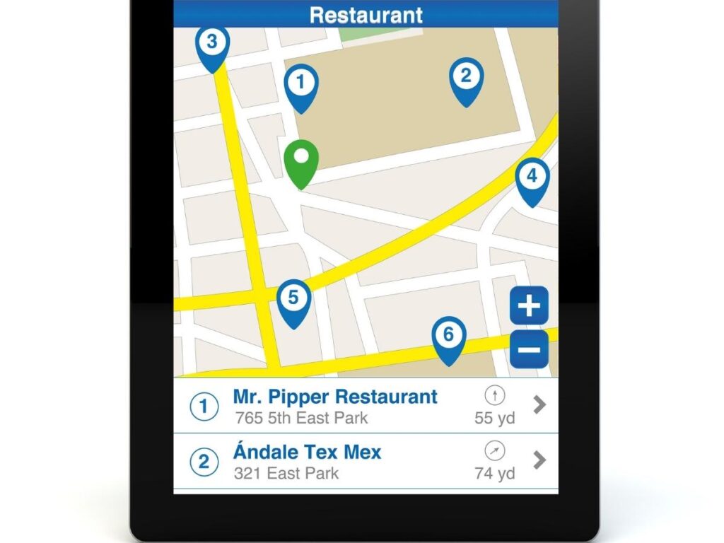 Google Maps on a tablet showing transit layer with metro lines and nearby restaurants pinned in a city neighborhood
