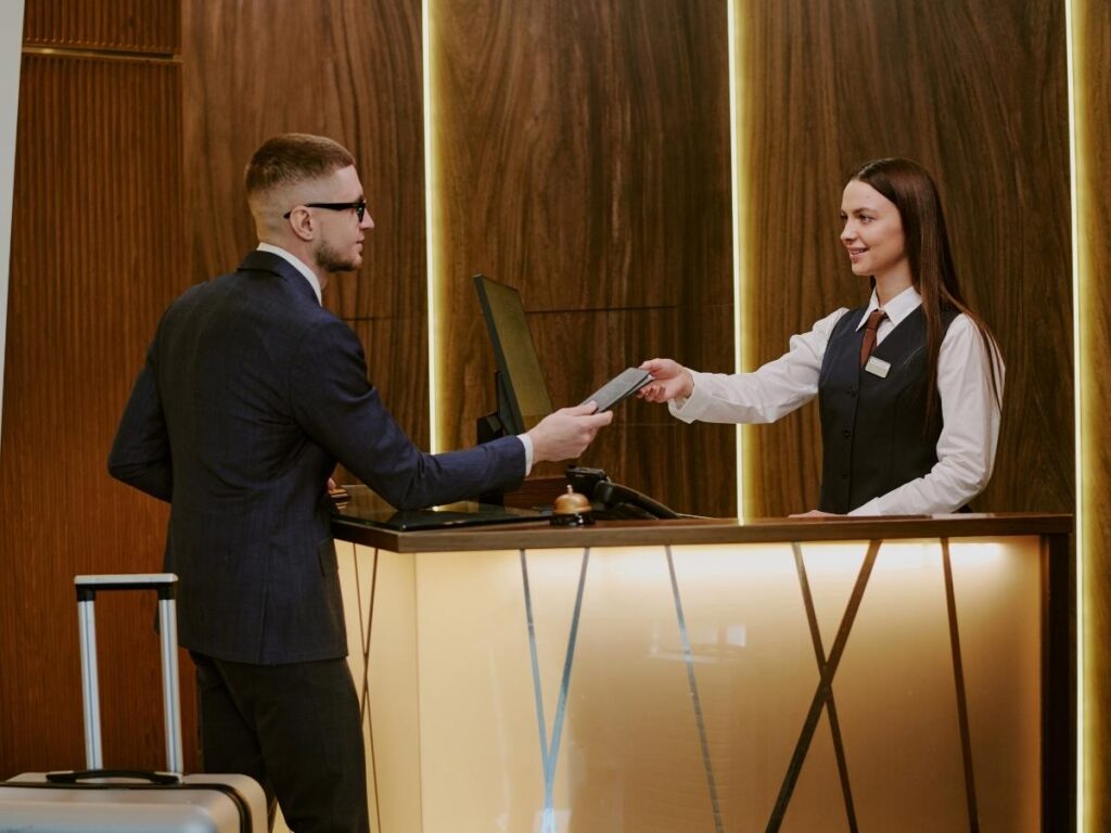 Suitcase propping open a hotel room door during initial check-in walkthrough